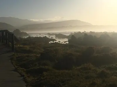 a view of a valley with a river and mountains at Olive Cottage in Hermanus