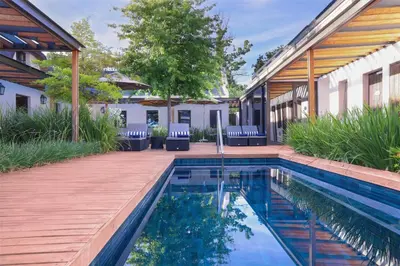 a swimming pool in the backyard of a house at Southern Sun de Wagen in Stellenbosch