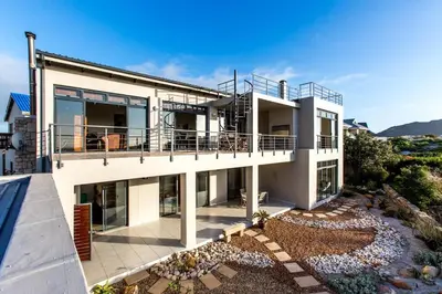 an aerial view of a house with a balcony at Gecko House in Pringle Bay