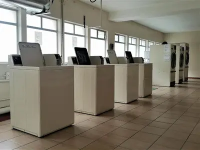 a row of counters in a room with machines at On The Beach At Strand in Strand