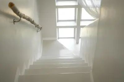 a stairway with a window and a stair case at Seagull Hermanus in Hermanus