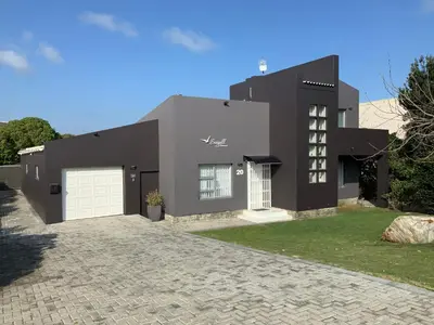 a rendering of a black house with a driveway at Seagull Hermanus in Hermanus