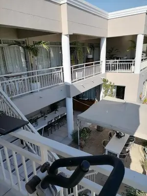 an overhead view of a building with tables and chairs at Sunset Boulevard Riverlodge in Paarl