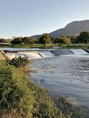 a spillway in a river with water at Sunset Boulevard Riverlodge in Paarl