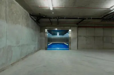an empty room with a pool in a building at Hotel Krige in Stellenbosch