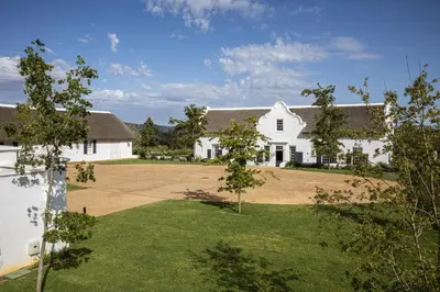 an aerial view of a white house with a yard at Brookdale Estate - Manor House in Paarl