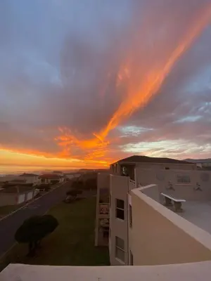 a view of a sunset from the balcony of a building at CView in Hermanus