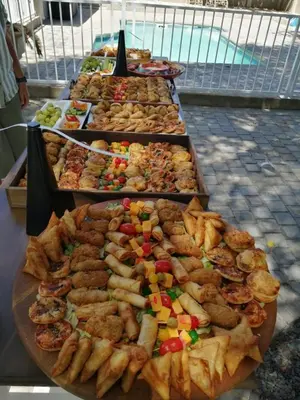 a buffet of different types of food on a table at Cape Winelands Business Villas in Joostenberg Vlakte