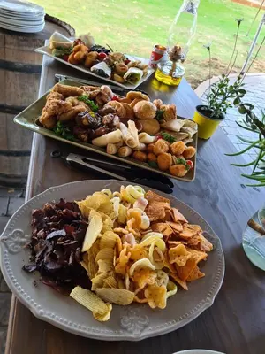 a table with two plates of food on it at Cape Winelands Business Villas in Joostenberg Vlakte