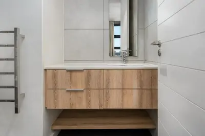 a bathroom with a sink and a mirror at Matrix Apartments in Cape Town