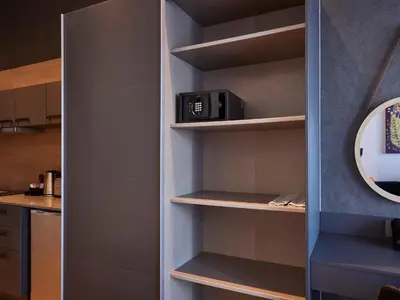 a walk in pantry with a cupboard at Bridgewater Apartments by Century City Hotels in Cape Town
