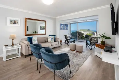 a living room with a couch and chairs at 29@Whale Rock Estate in Hermanus