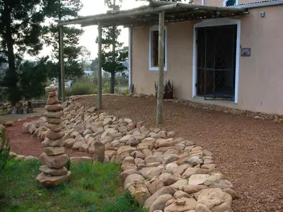 a pile of rocks in front of a house at Akkedis at Artemis in Franschhoek