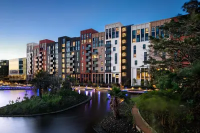 a view of a city at night with buildings at Century City Hotel Bridgewater in Cape Town
