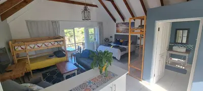 a room with a bedroom with a bed and bunk beds at Cape Dutch Flair in Durbanville