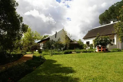 a house with a green yard with a house at Mooi Bly in Paarl