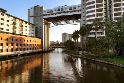 a bridge over a river in a city with buildings at Knightsbridge 407 by Host Agents in Cape Town