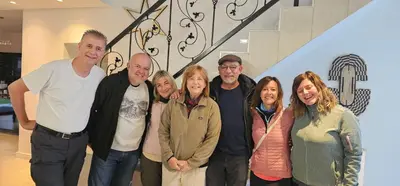 a group of people posing for a picture in a lobby at Villa Parisienne Modern Guest house in Cape Town