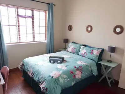 a bedroom with a bed with a stuffed animal on it at Proleefic House on Florence in Bellville