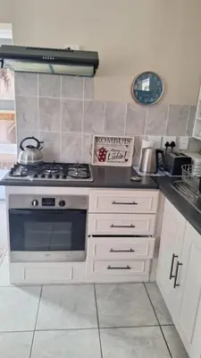 a kitchen with a stove and a tea pot on it at Senelle accomodation in Hermanus