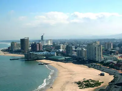 a view of a beach with buildings and the ocean at Ocean-Song in Strand