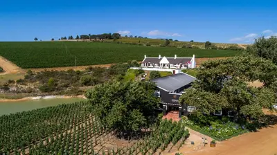 an aerial view of a large house in a vineyard at Aaldering Luxury Lodges in Stellenbosch