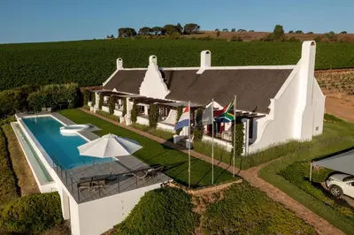 an aerial view of a house with a swimming pool at Aaldering Luxury Lodges in Stellenbosch