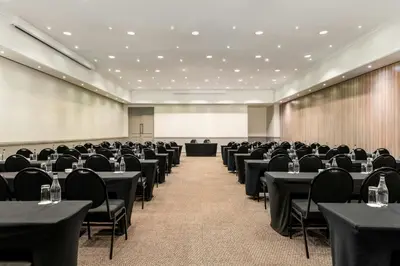 a conference room filled with tables and chairs at Lord Charles Hotel, Somerset West, a Tribute Portfolio Hotel in Somerset West