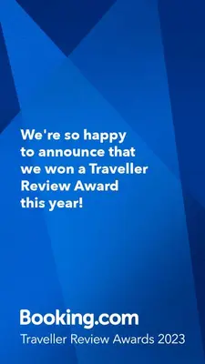 a blue sign that says were so happy to announce that we won a traveler at SpaciousNetflix#Wifi#Parking#CentralWinefarms#Mall in Cape Town
