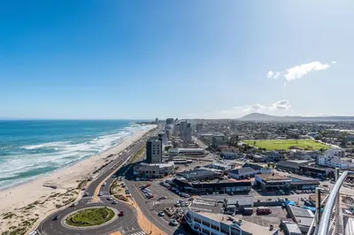 an aerial view of a city and the beach at Horizon Bay 1502 in Cape Town