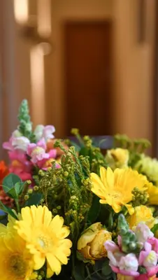 a bunch of flowers sitting on a table at Cabriere Cottage in Franschhoek