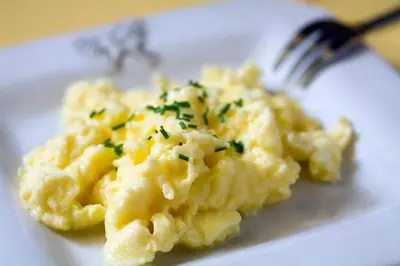 a plate of mashed potatoes with a fork on it at The Sanctuary Guest House Estate in Cape Town