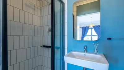 a bathroom with a sink and a mirror at Shore2Please in Cape Town