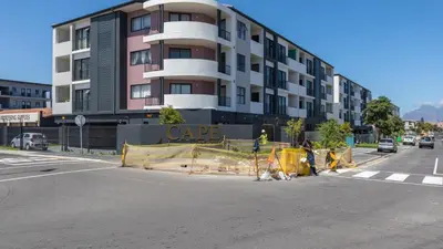 a building is under construction on a city street at Shore2Please in Cape Town