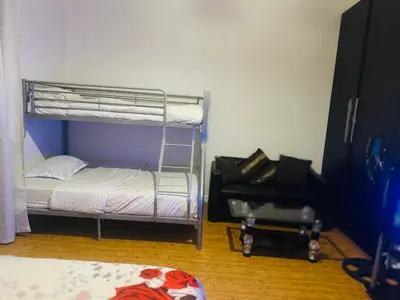 a bedroom with a bunk bed and a room with a bed gmaxwell gmaxwell gmaxwell gmaxwell at Peaceful getaway in Cape Town