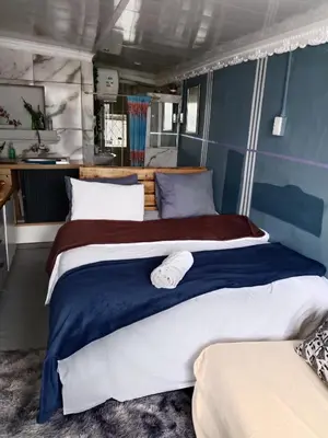 a bedroom with two beds in a room at Cozy Private En Suite Studio in Cape Town