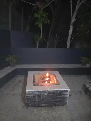 a fire pit in a yard at night at In die Hoekie in Hermanus