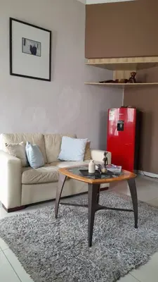 a living room with a couch and a coffee table at Limbila House in Cape Town