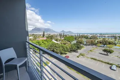 a balcony with a view of a city at Sea and Sun-Table Mountain views Wifi Parking! in Cape Town