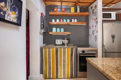 a kitchen with a counter with a coffee maker on it at Art Box in Greyton