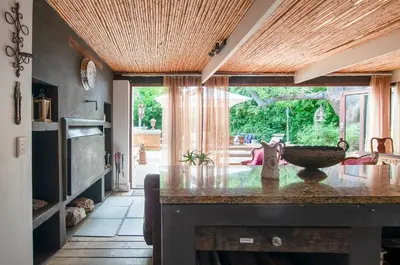 a kitchen with a table with a bowl on it at Art Box in Greyton