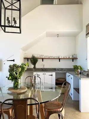 a dining room with a glass table and chairs at Penhill Farm West Grange in Nuy