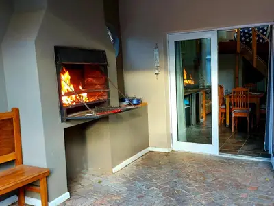 a living room with a fireplace in the wall at Suites on 74 in Worcester