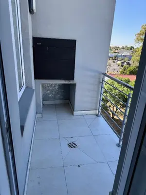 a view of a room with a window and a tile floor at Beautifully furnished loft apartment in central Durbanville in Durbanville