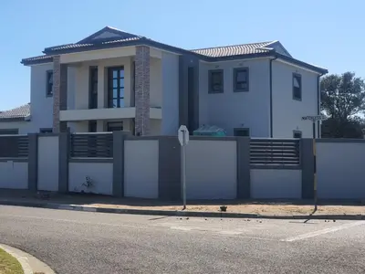 a house on the side of a street with a stop sign at ELMED GUEST HOUSE in Cape Town