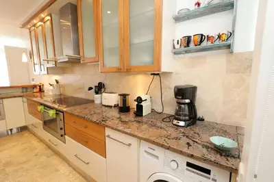 a kitchen with a counter top with a coffee maker at Hermanus Seaview Apartment in Hermanus