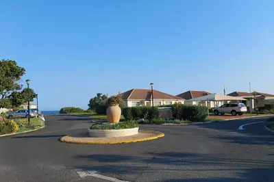 a street with a vase in the middle of the road at First Group Hermanus Beach Club in Hermanus