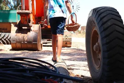 a person standing next to a large truck at Blou Porselein Guestfarm in Hermon