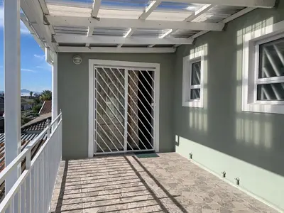 a patio with a door on a house at manu'z in Cape Town