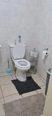 a bathroom with a white toilet in a room at SEASCAPE MEWS 27 in Cape Town